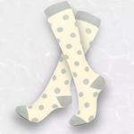 Beige with grey spots
