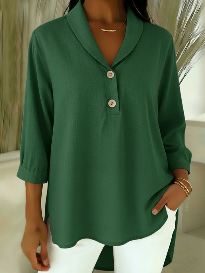 Relaxed fit V-neck blouse for women, featuring comfortable 3/4 sleeves. Stylish everyday top for spring and summer.