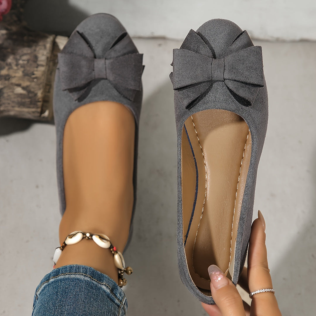 Nude comfortable women's wedge flats, everyday slip-on shoes with delicate bow & low wedge heel.
