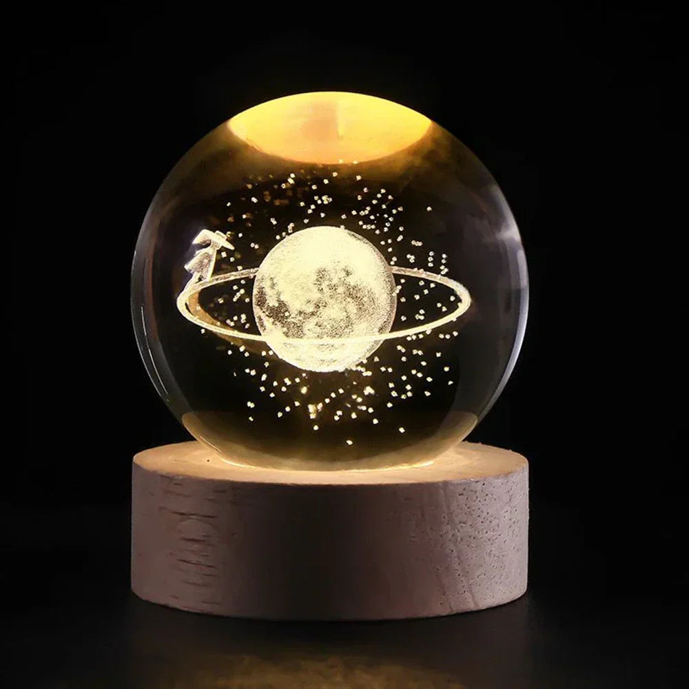 Nvroome 3D galaxy luminous crystal ball desk lamp with wooden base, casting a soft glow. Great for ambiance.