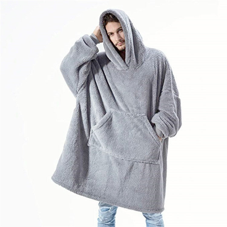 Folded oversized hoodie blanket in a rich burgundy, ready to provide warmth and comfort.
