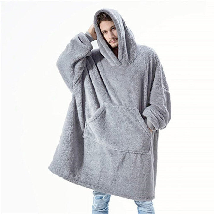 Folded oversized hoodie blanket in a rich burgundy, ready to provide warmth and comfort.