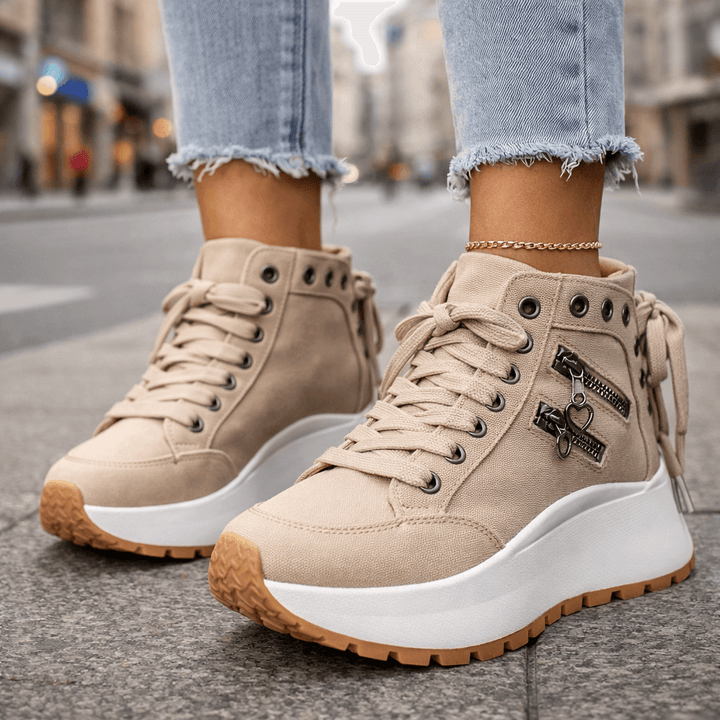Woman rocking stylish high-top platform sneakers, showcasing a chic & modern casual street style look.