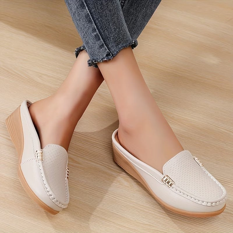 Chic women's wedge loafers, a versatile slip-on sandal for comfortable everyday wear.