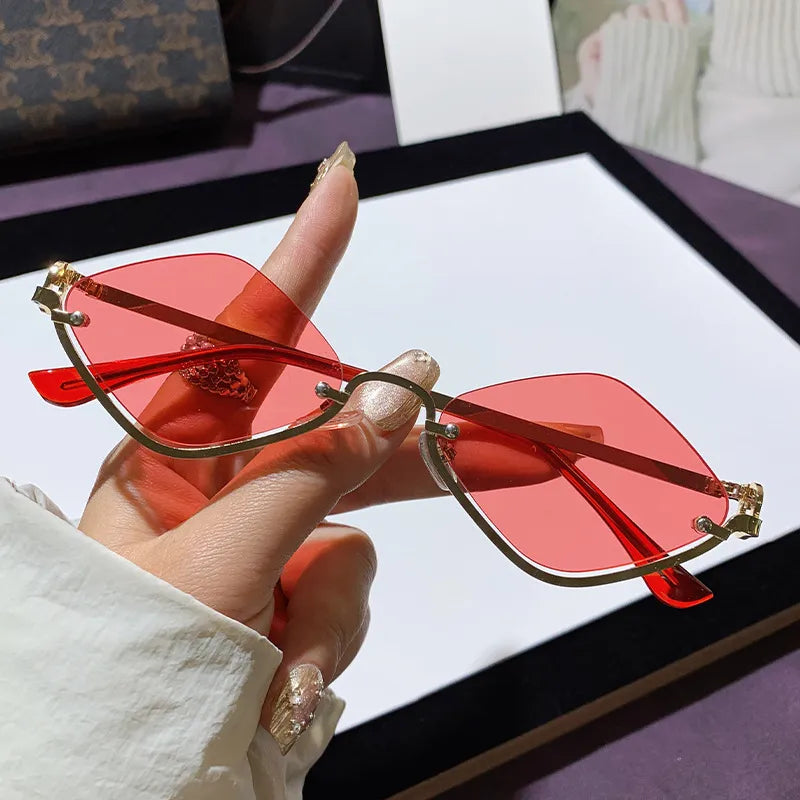 Bold cat-eye sunglasses for women with trendy tinted lenses and UV400 protection; a striking fashion accessory.