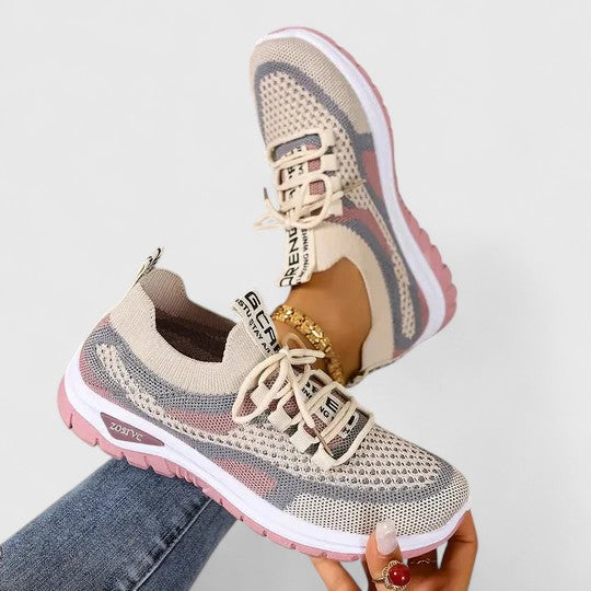 Lace-up women's sneakers, featuring lightweight design & superior comfort for daily support & walking.