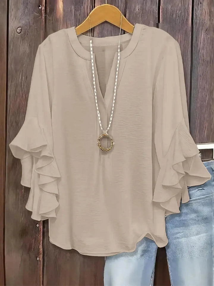 Women's short sleeve V-neck casual blouse for comfortable everyday wear.