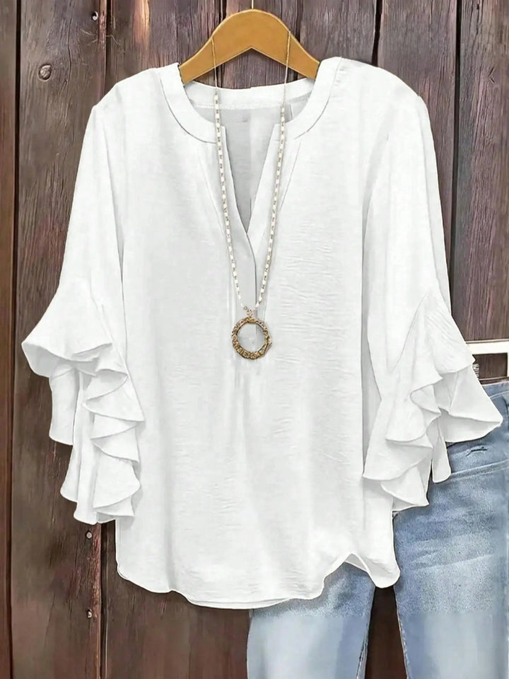 Stylish women's short sleeve casual top with V-neck, great for everyday comfort.