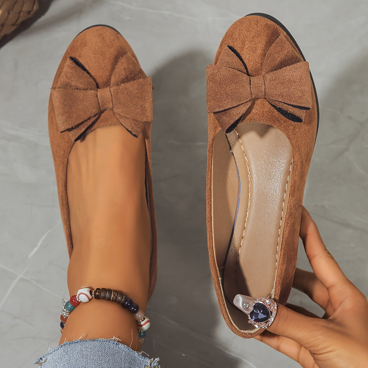 Grey comfortable slip-on wedge flats, women's footwear with bow detail for versatile daily styling.