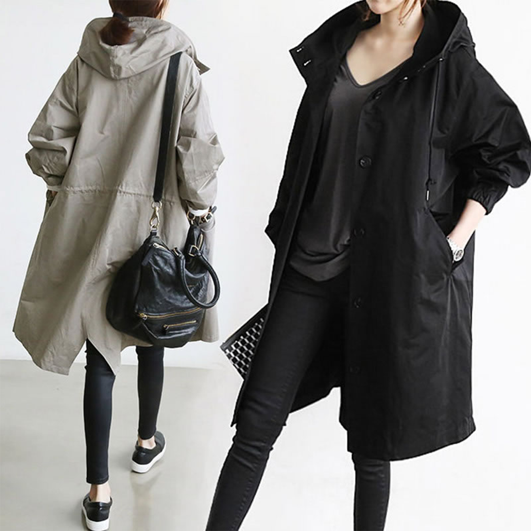 Elegant women's long waterproof raincoat with hood, perfect for stylish protection & sophisticated rainwear.