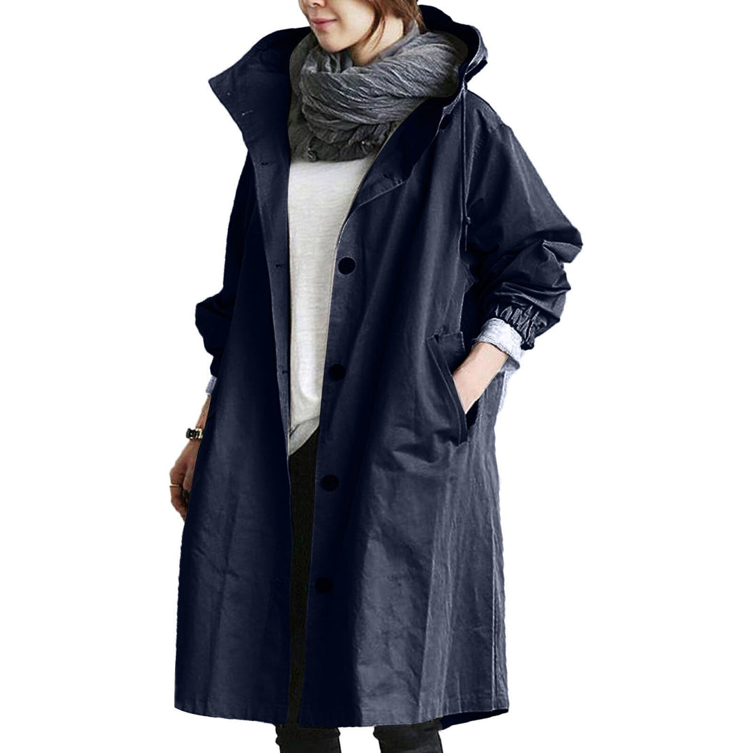 Long waterproof raincoat for women, offering full coverage & elegant style in wet weather. Fashionable outerwear.
