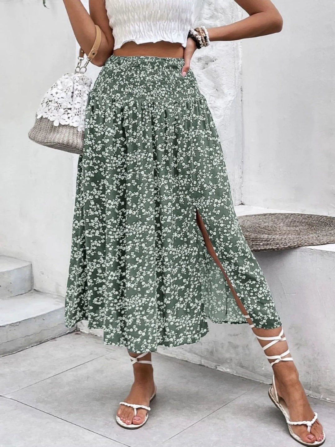 Flowy women's printed summer skirt with comfortable smocked waist and elegant side slit for beach.