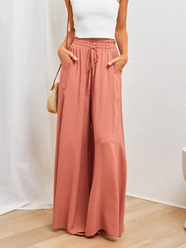 Elegant women's high waist wide leg trousers, perfect for sophisticated work or resort wear.