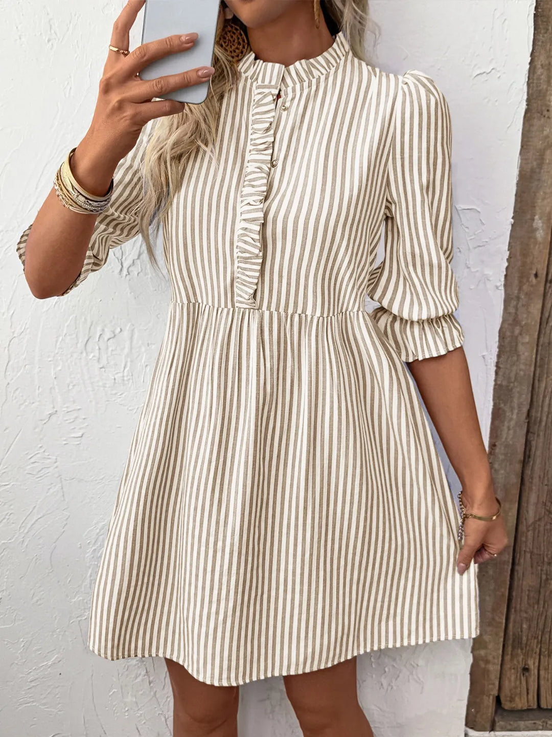 Comfortable women's striped button-down midi dress. Features half sleeves & collared design, a stylish tan shirt dress.