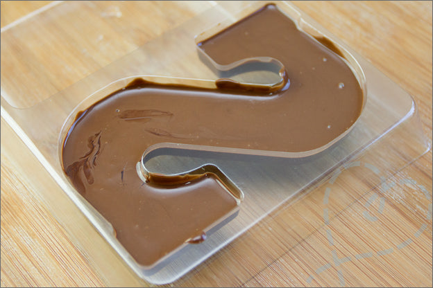 Durable 3D silicone letter mold, essential kitchen accessory for DIY candy & crafts.