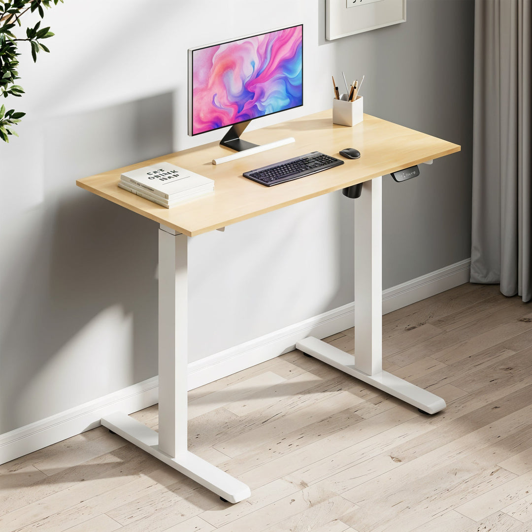 Ergonomic electric standing desk for home office. Height adjustable computer table for comfortable workspace.