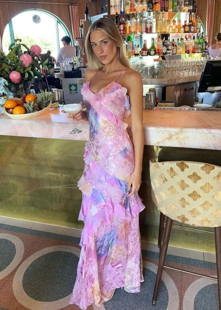 Elegant women's flowy maxi dress, floral pattern, ruffles. Ideal summer formal occasion or party wear.