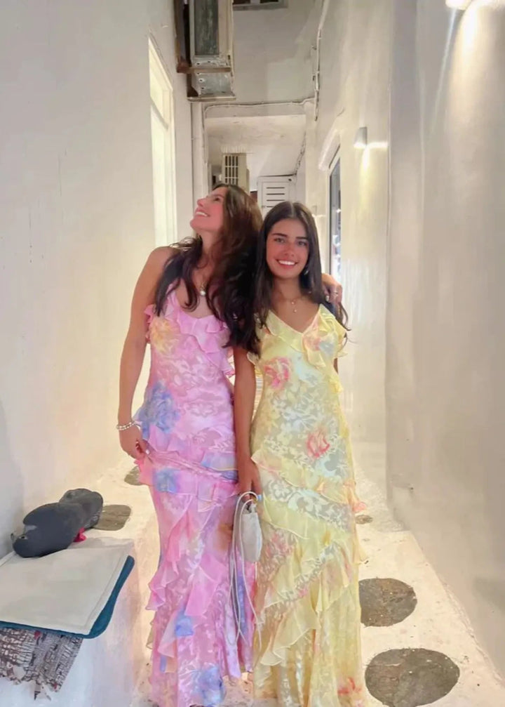 Flowy floral maxi dress for women, elegant ruffles & spaghetti straps. Ideal chic summer formal and party wear.