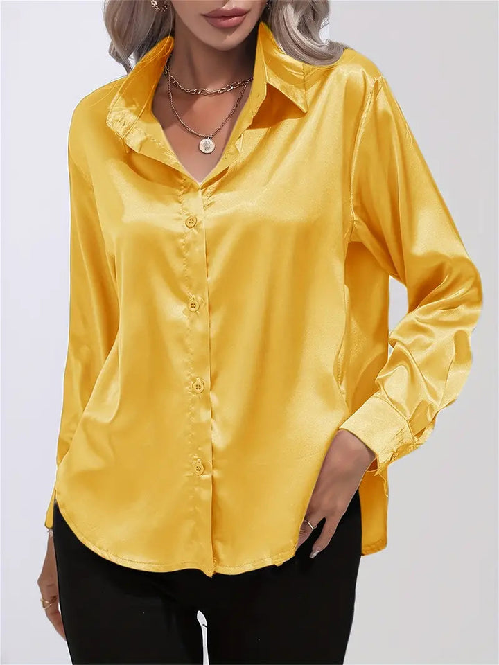 Sophisticated women's white blouse, long sleeve, perfect for a chic office look.