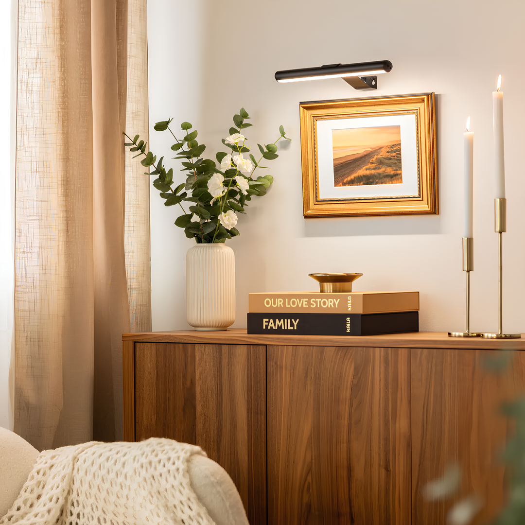 Modern wireless LED picture light with dimmable settings. Rechargeable wall lamp for home decor & art.