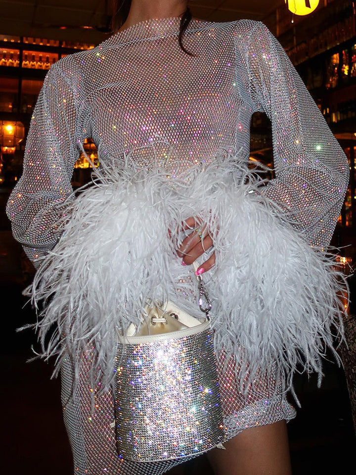 Special occasion sequin dress for women, shimmering with feather-cuffed elegance.