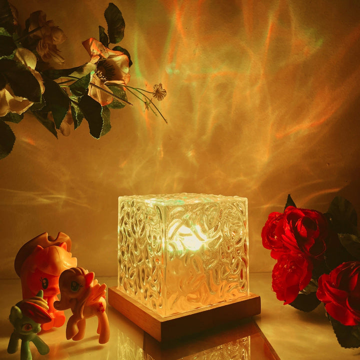 Northern Lights aurora projection lamp casting serene, colorful mood lighting in a bedroom.