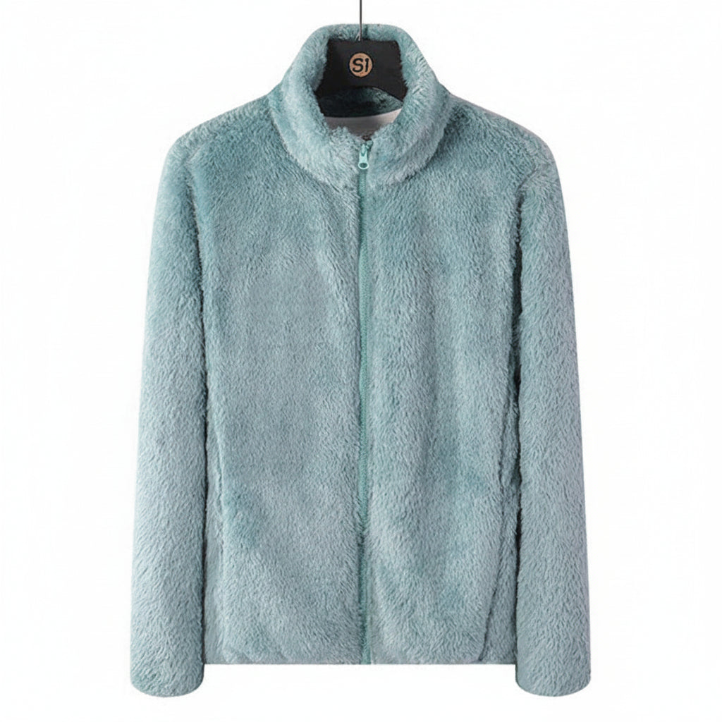 Close-up of the soft plush texture of a women's cozy high-collar jacket, ideal for winter.