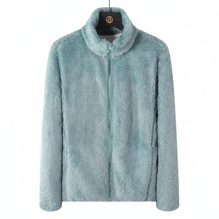 Close-up of the soft plush texture of a women's cozy high-collar jacket, ideal for winter.