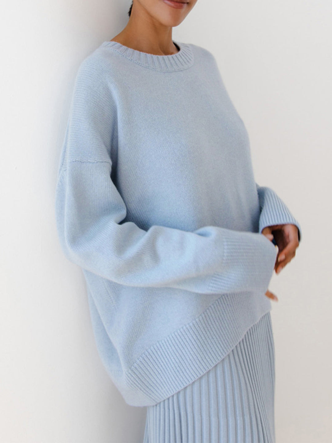 Comfortable oversized women's crewneck knit sweater, an essential layering piece for cozy style.