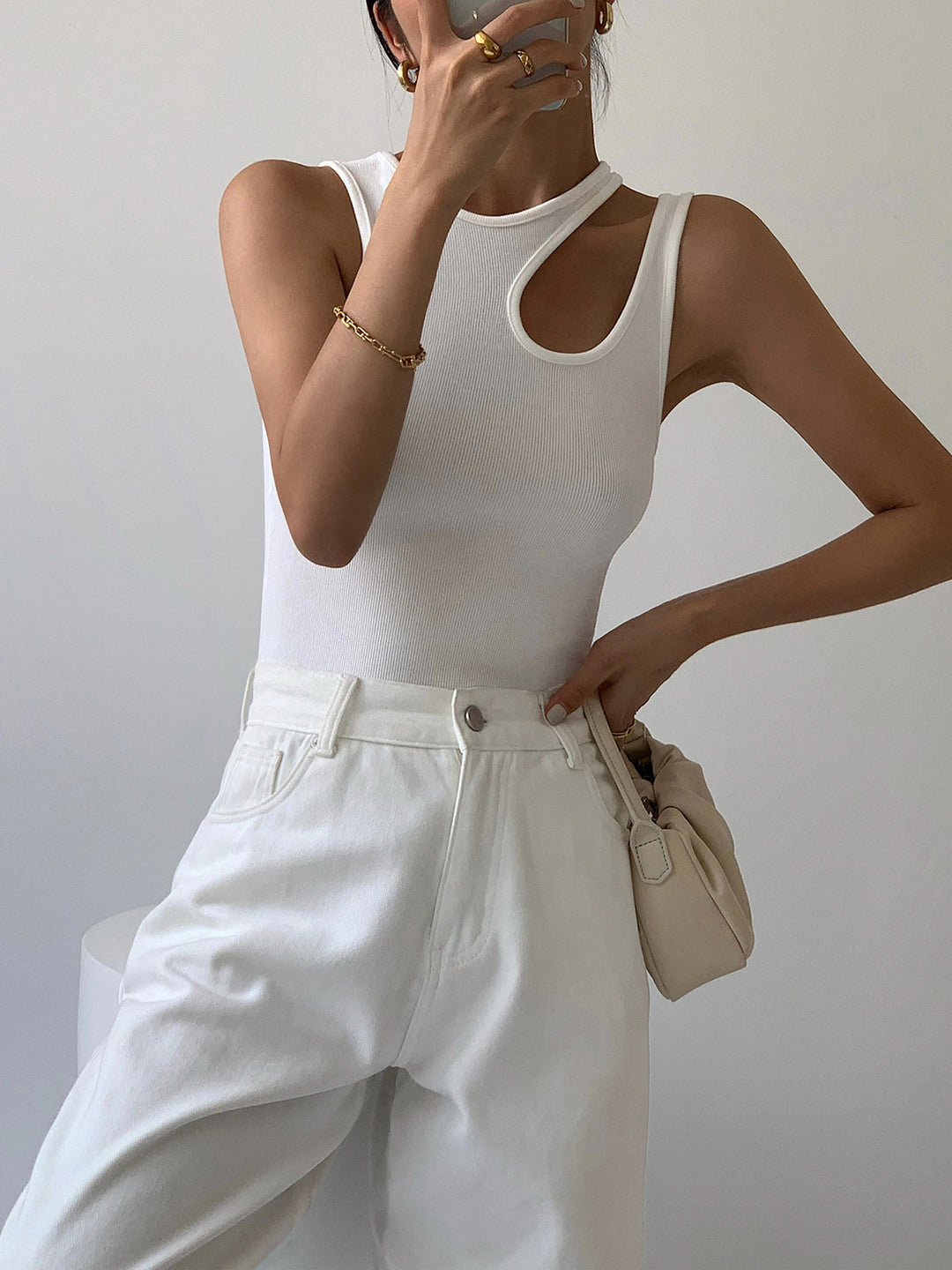 Stylish women's ribbed cutout tank top, a fashionable sleeveless piece for trendy summer apparel & everyday style.