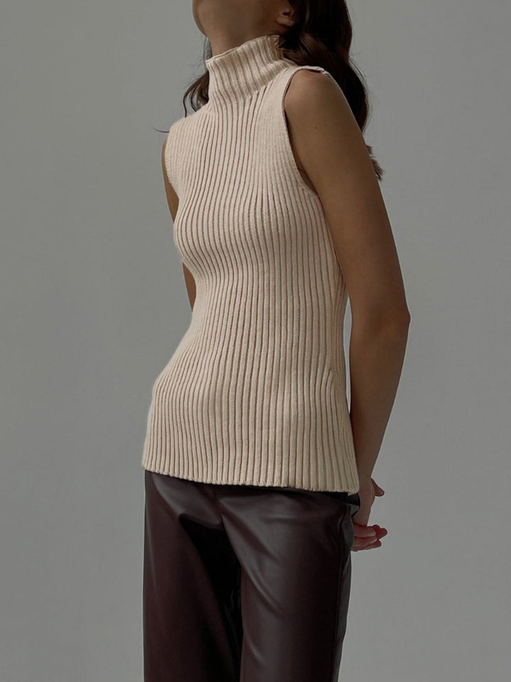 Close-up of a women's ribbed knit sleeveless mock neck top, versatile for everyday fashion.