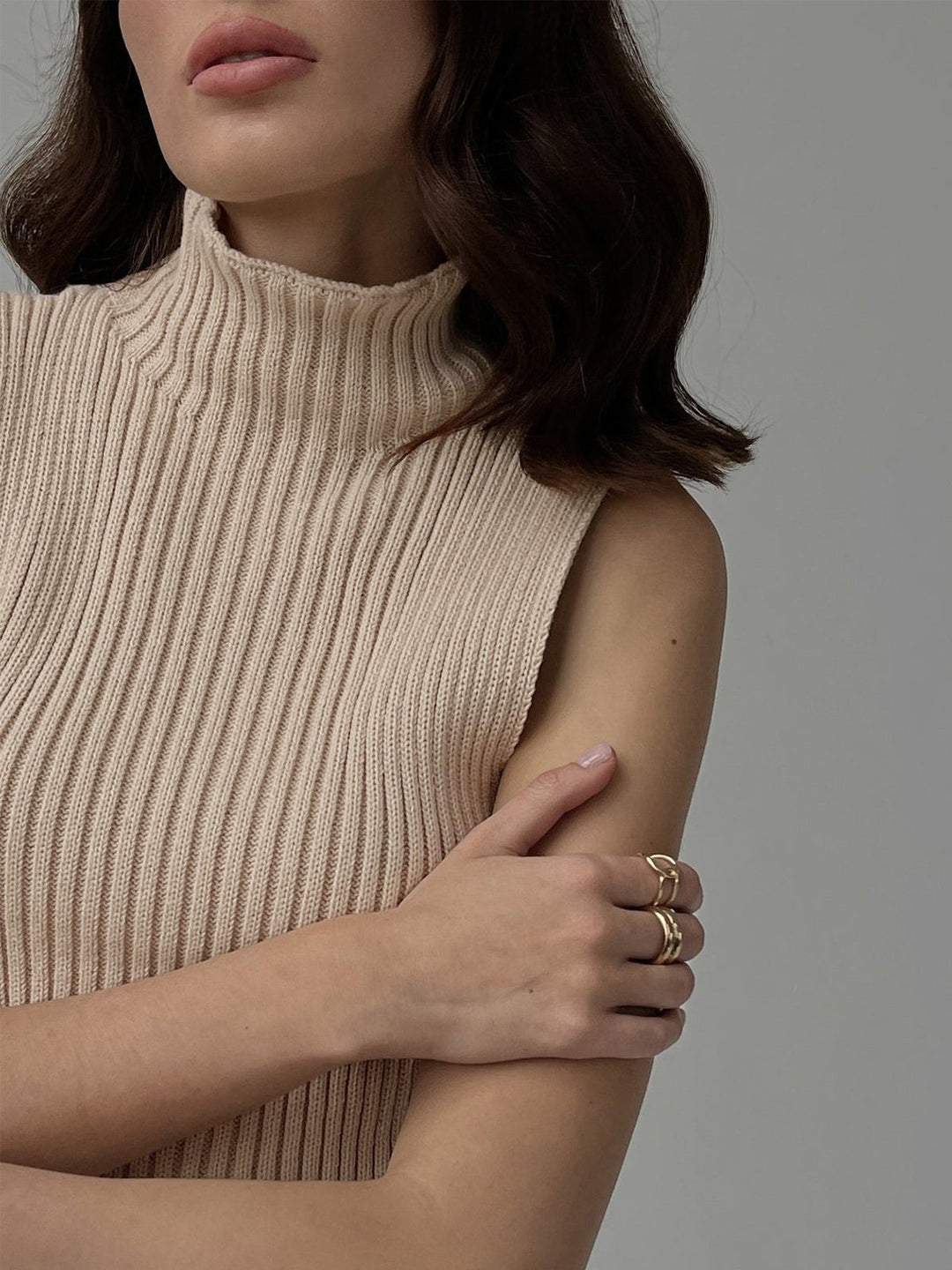 Lightweight women's sleeveless ribbed mock neck top, a comfortable summer essential.