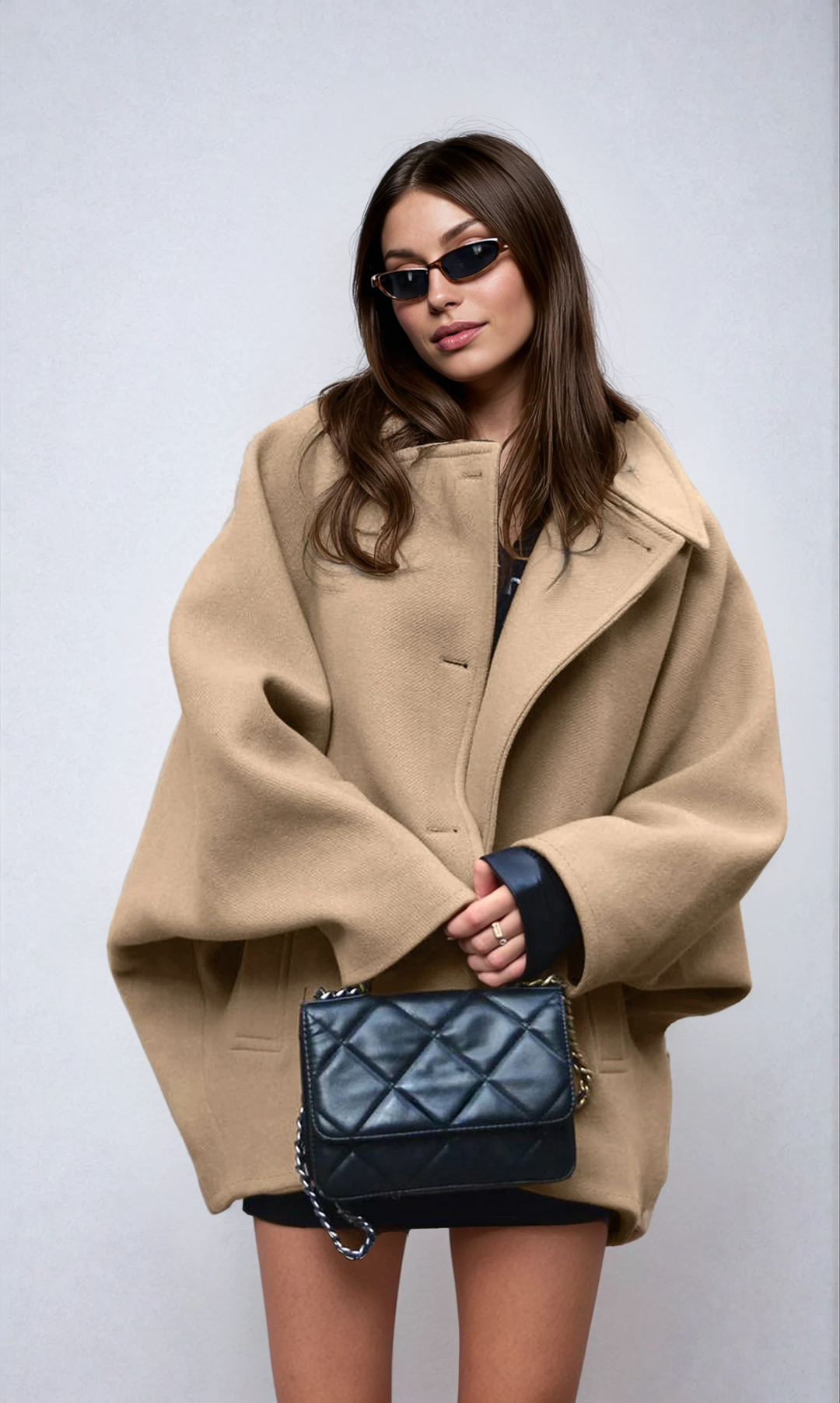 Black women's oversized winter coat, warm and stylish outerwear with button-front closure for winter.