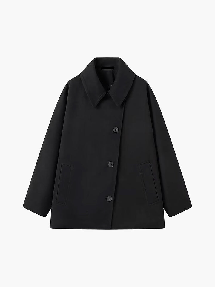 Warm women's oversized winter coat, a chic button-down outerwear piece for elegant cold-weather fashion.