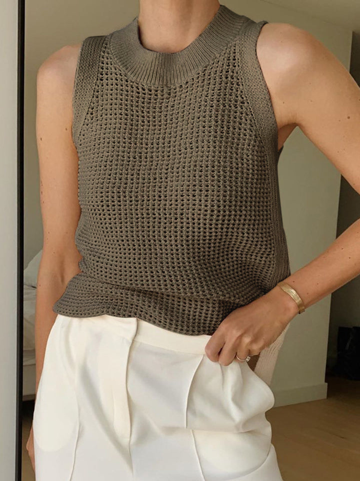Chic sleeveless tank top for women, featuring a stylish cut-out design, versatile for any casual outfit.