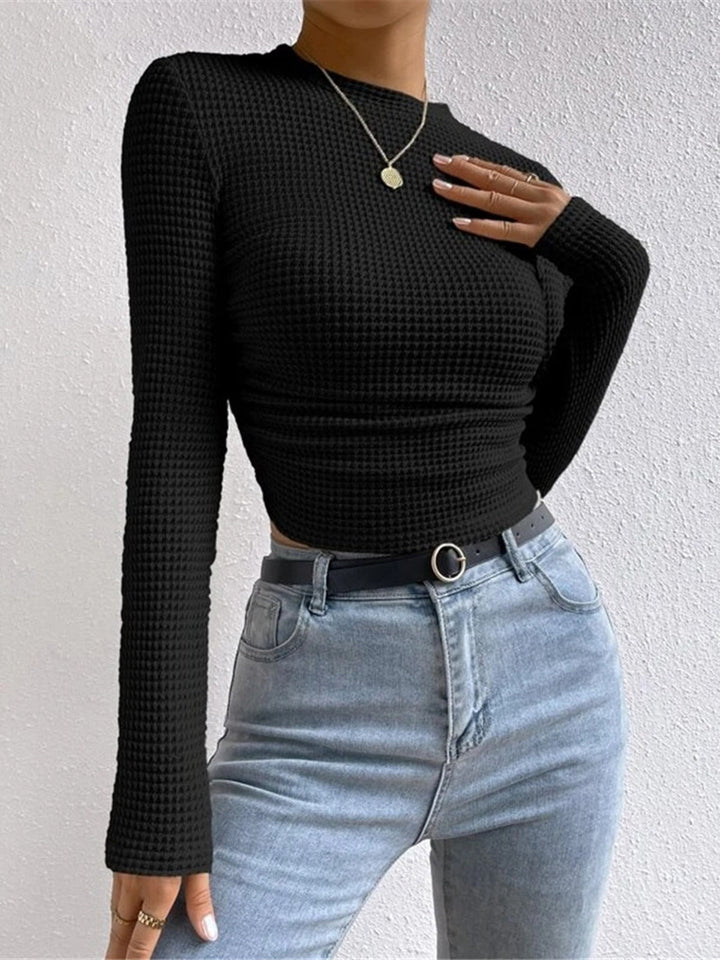 Versatile women's long sleeve waffle knit top, perfect for casual layering and comfortable winter style.