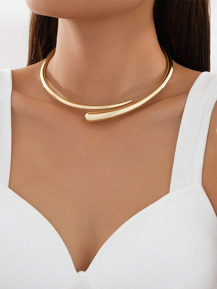 Elegant women's gold water drop open choker necklace, a minimalist fashion jewelry accessory for a statement look.