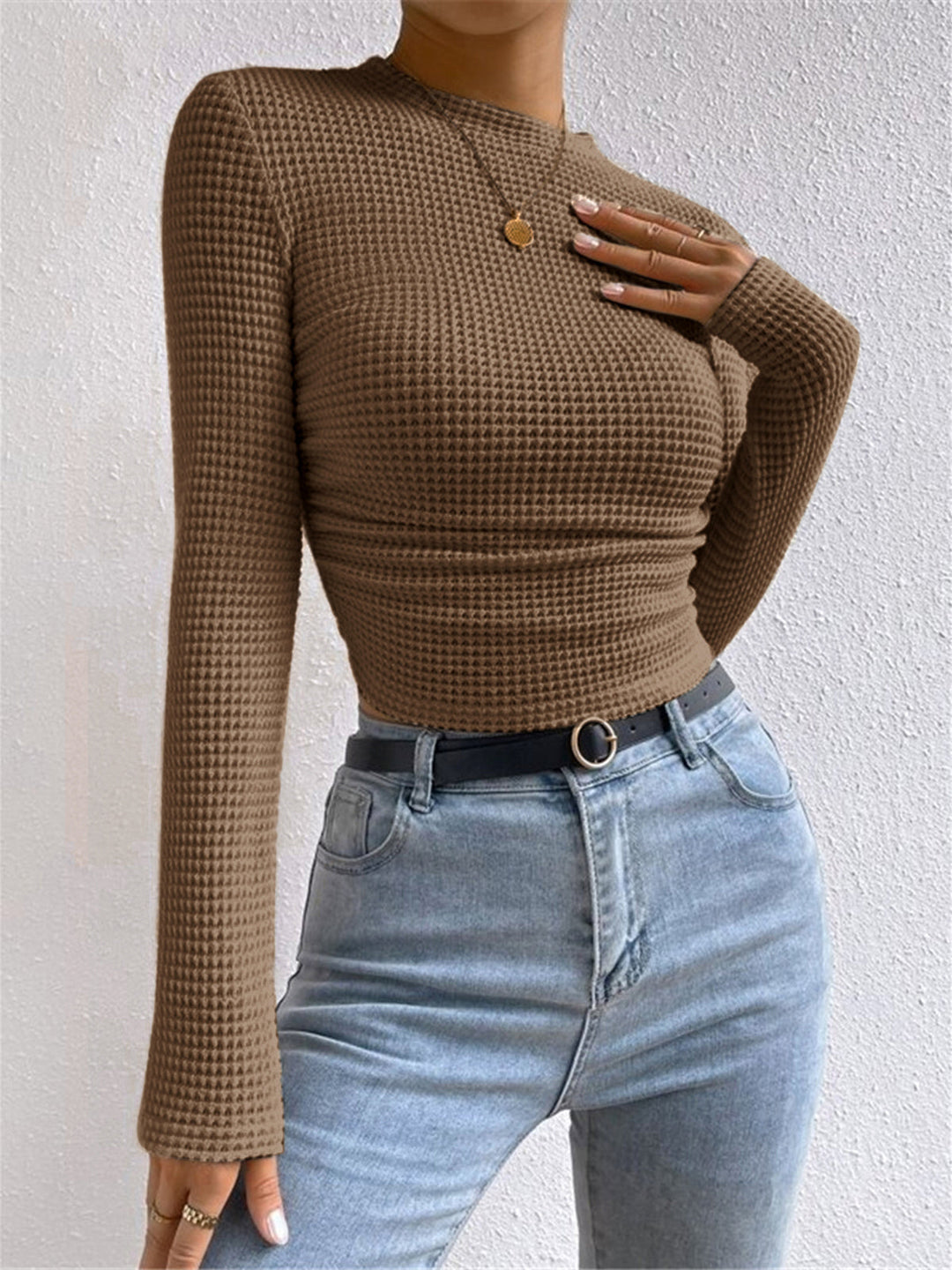 Layerable women's waffle knit long sleeve top, a casual and cozy choice for everyday winter comfort.