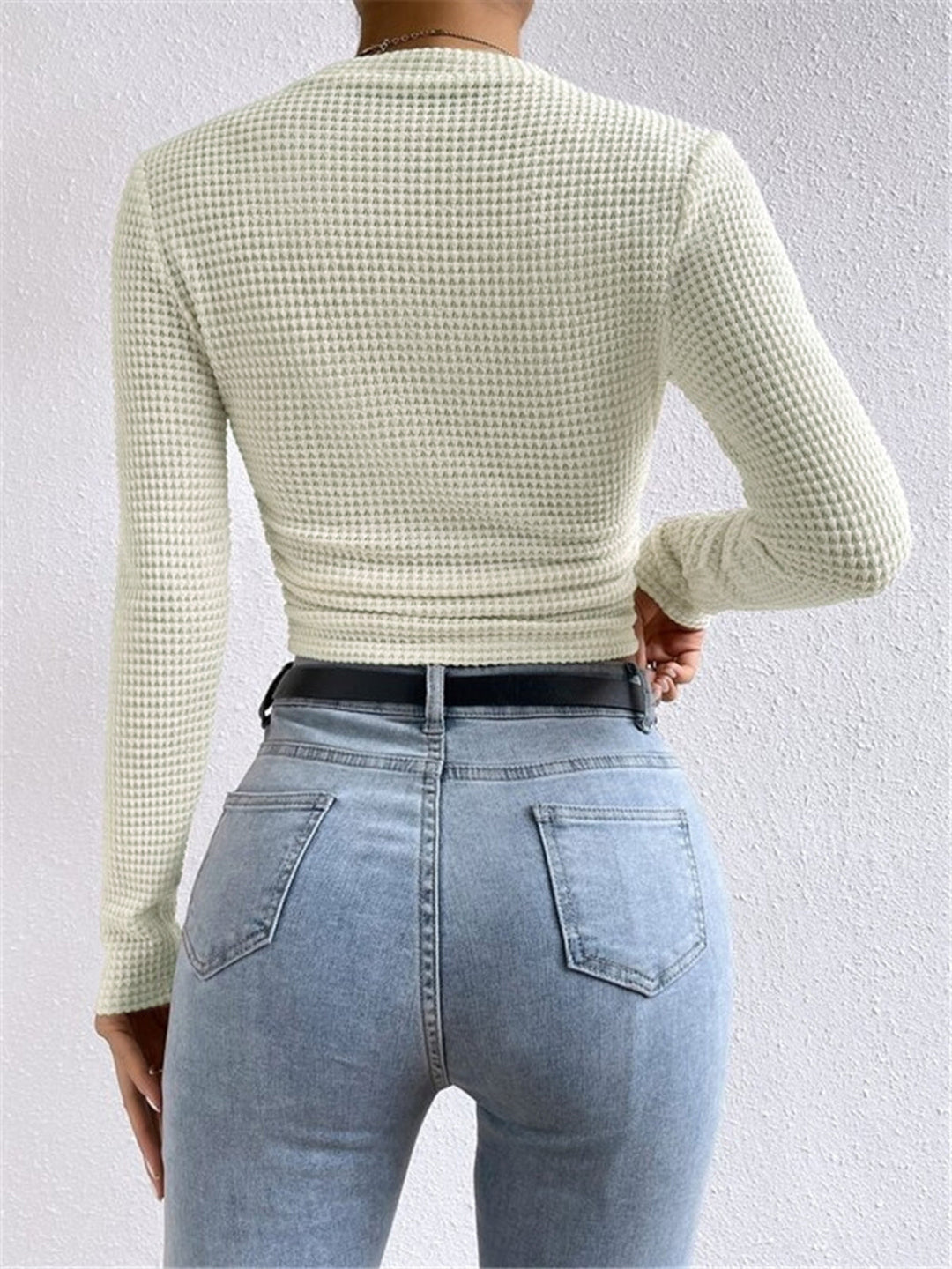 Soft waffle knit long sleeve top for women, offering cozy comfort and casual style for winter layering.
