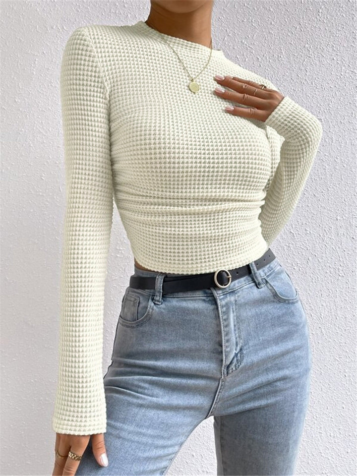 Relaxed fit women's cropped long sleeve waffle knit top, great for casual winter and everyday comfort.