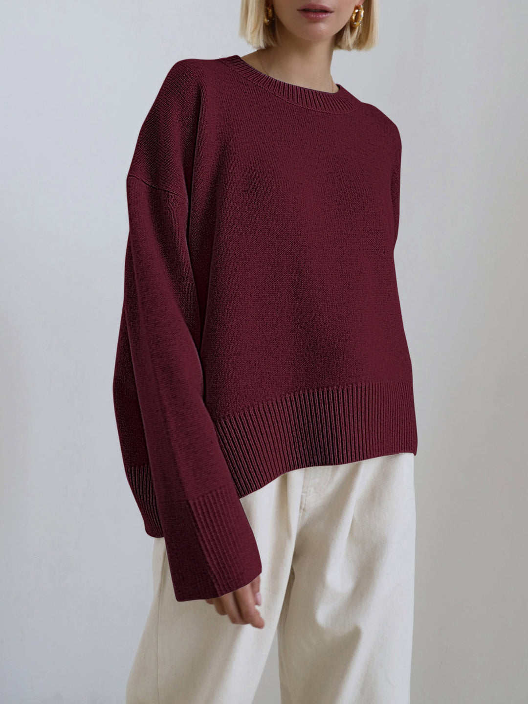Modern women's oversized crewneck sweater in a relaxed knit, perfect for cozy and comfortable casual styling.