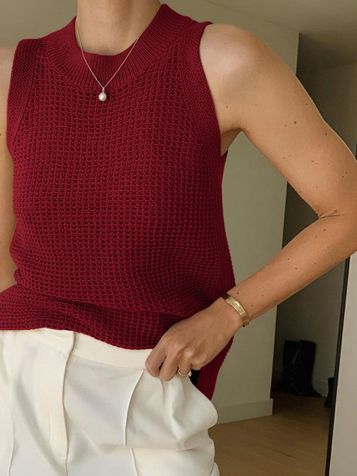 Versatile women's sleeveless tank top with a chic cut-out, great for layering or casual summer wear.