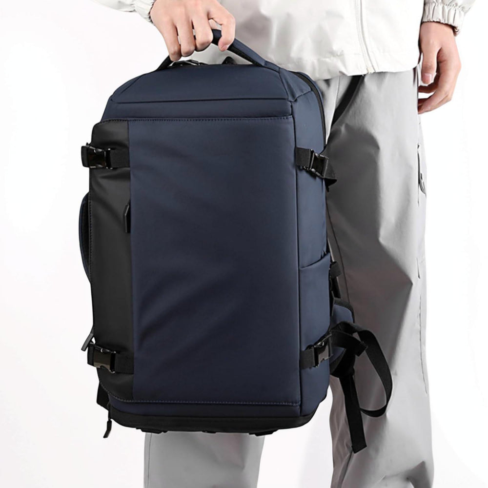 Carry-on size unisex travel backpack, perfect laptop bag for business trips, with external USB charging access.