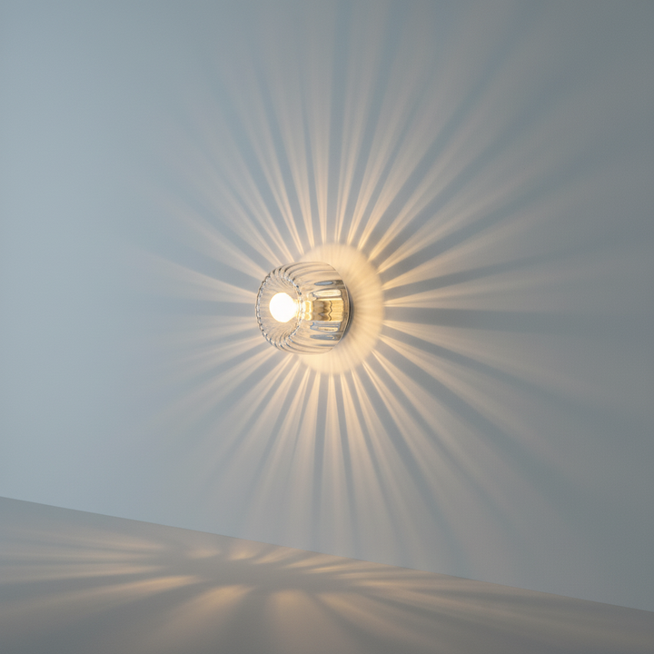 Minimalist Bauhaus LED wall sconce, durable metal & clear glass, offers modern, energy-efficient home lighting.