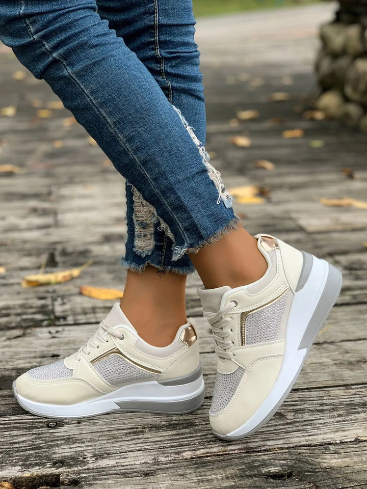 Comfortable women's slip-on platform sneakers, featuring shimmering rhinestones for stylish everyday wear.