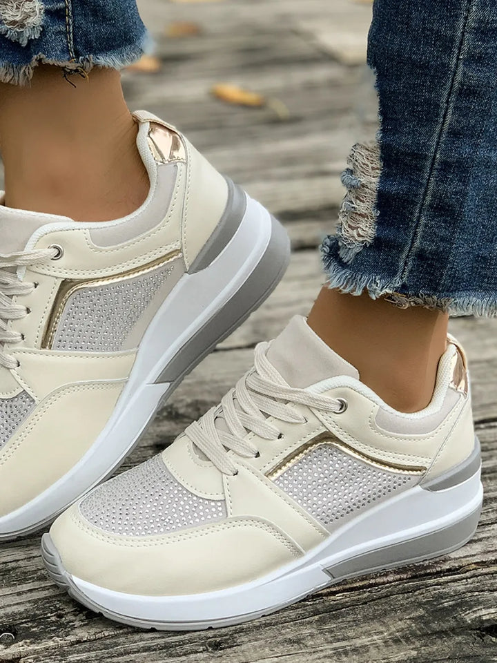 Stylish ladies' chunky sole platform sneakers, embellished with sparkling rhinestones for a fashionable look.