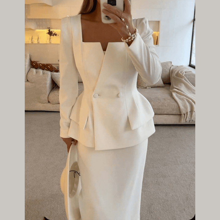 Professional women's tailored blazer, part of a two-piece skirt set. Modern business attire power suit.