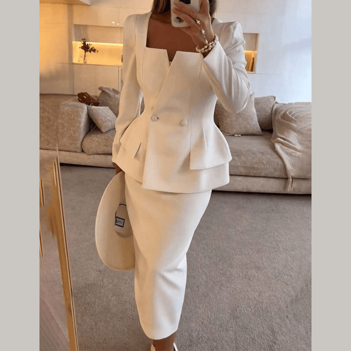 Women's professional two-piece tailored blazer and skirt set. Elegant office wear for business attire.