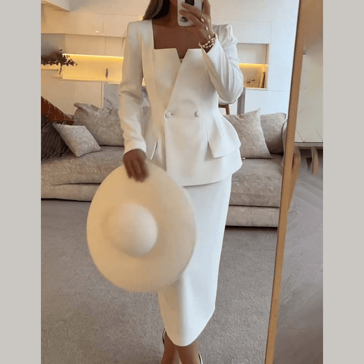 Women's professional power suit. Two-piece tailored blazer and skirt set for chic office wear & business attire.