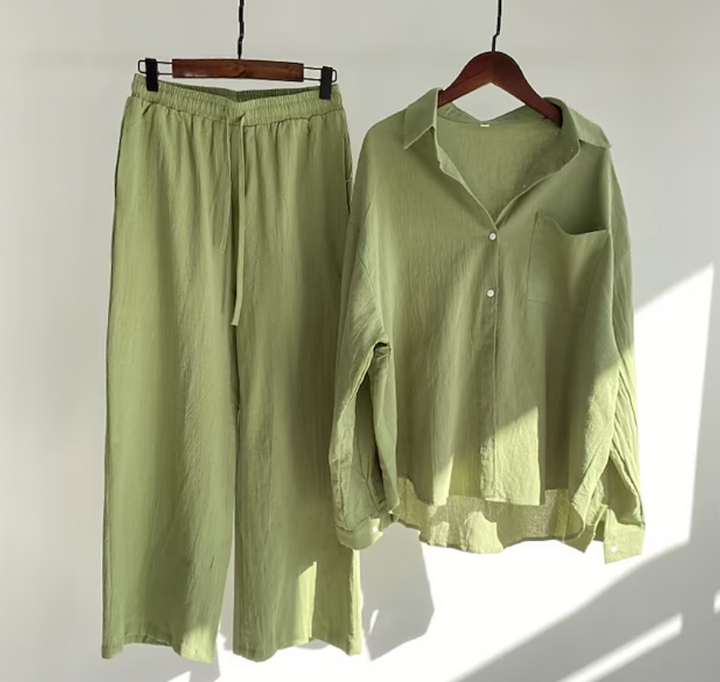 Coordinated women's long sleeve collared shirt and fluid wide-leg pants set. Effortless and stylish.